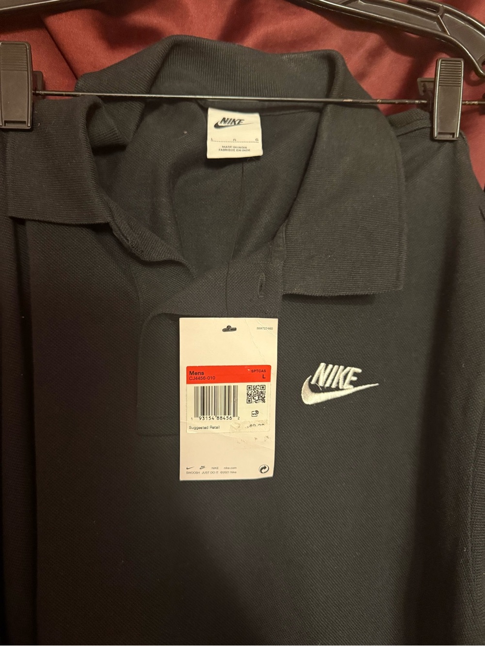 Nike Black Polo with White Swoosh Embroidered Logo